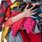 woman holding dirty laundry