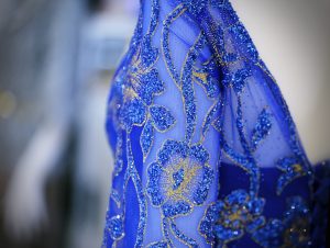 Blue woman beautiful dress fabric closeup