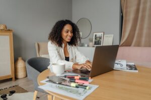 smiling woman working at laptop